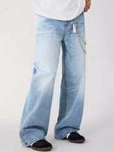 Men’s light-wash denim relaxed fit wide-leg jeans with subtle fading and chain detail on the side seam