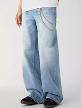 Men’s light-wash denim relaxed fit wide leg jeans with silver chain detail along the side seam