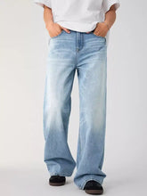 Men’s light-wash denim relaxed fit wide leg jeans with a straight-cut silhouette ideal for casual wear