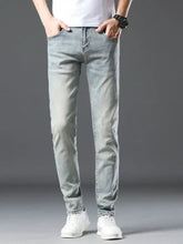 Men’s wash slim fit jeans in light-wash denim with a slim fit and subtle distressing details