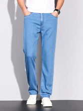 Men’s wash slim fit jeans in light blue denim with straight-leg cut and classic five-pocket design