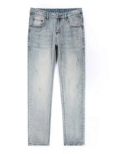 Men’s wash slim fit light-wash denim jeans with subtle distressing and a slim fit design