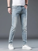 Back side of men’s wash slim fit light-wash denim jeans with subtle fading classic stitching and branded patch on pocket