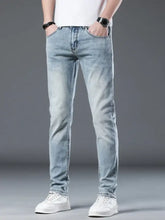 Men’s wash slim fit jeans in light-wash denim with subtle fading and a slim fit for a modern look