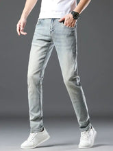Men’s wash slim fit jeans in light-wash denim with slim fit and subtle distressed details