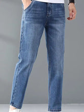 Men’s blue denim straight leg jeans with subtle fading in a wash finish for casual wear