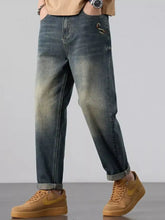Men’s wash straight leg dark-wash denim jeans with a faded gradient effect and an embroidered snake detail on the thigh