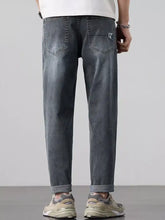 Men’s wash straight leg dark gray denim jeans with a relaxed fit and rolled cuffs