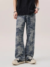 Men’s wash wide leg jeans in denim with a faded distressed blue and gray camouflage pattern
