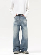 Men’s light-wash denim wash wide leg jeans with a relaxed fit and subtle fading for a contemporary look