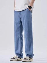 Men’s wash wide leg jeans in light-wash blue denim with a relaxed straight-leg cut