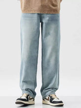 Men’s light-wash denim wash wide leg jeans with slight stretch and relaxed straight-leg cut for a casual look