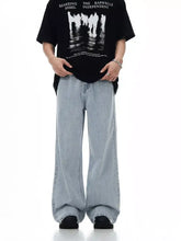 Men’s wash wide leg jeans in light-wash denim with a relaxed oversized fit showcasing wide leg jeans style