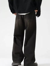 Men’s wash wide leg jeans in black denim with faded wash and classic stitching showing wide leg design