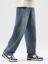 Men’s blue denim wide leg jeans with relaxed straight-leg cut and subtle fading for casual wear