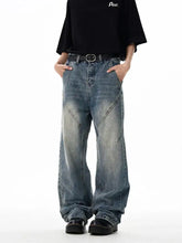 Men’s wash wide leg jeans in faded blue denim with visible stitching details and a relaxed fit wide leg design