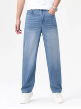 Mens wash wide leg jeans in light-wash blue denim with a relaxed straight-leg cut for comfortable wear