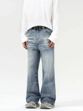 Men’s light-wash denim wash wide leg jeans with a relaxed fit and subtle fading in a straight-leg cut