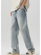 Men’s wash wide leg jeans in light-wash denim with a relaxed straight-leg cut and subtle fading for a casual look