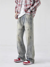 Men’s wash wide-leg jeans in washed-out gray denim with a distressed faded look and subtle glittery accents