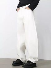 Men’s wash wide leg jeans in white denim with a relaxed tapered fit and visible stitching details