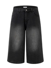 Mens washed denim Bermuda shorts with black wide-leg culottes and faded wash