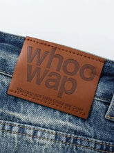 Brown leather WHOOWAP patch on mens washed denim bermuda shorts