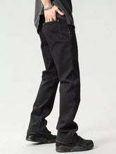 Black straight-leg denim jeans with a slim fit and subtle stitching details.