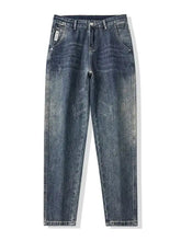 Men’s washed loose fit jeans in dark-wash denim with a relaxed fit and subtle distressed details visible from the back