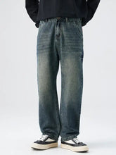 Men’s dark-wash denim relaxed fit jeans with a straight-leg cut and subtle fading for a vintage look
