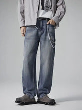 Men’s washed relaxed wide-leg blue denim jeans with decorative pearl chain on belt loop and relaxed fit