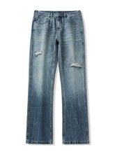 Men’s washed ripped bootcut jeans in light-wash denim with distressed frayed patches on the knees and straight-leg cut