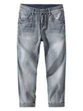 Men’s washed slim fit light-wash denim jeans with rolled cuffs made of durable cotton material