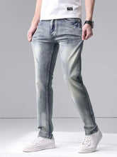 Men’s washed slim fit jeans in light-wash denim with subtle fading along the thighs and a slim fit design