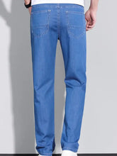 Men’s washed straight fit blue denim jeans with classic straight-leg cut and visible stitching on back pockets back side view