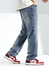 Men’s blue denim washed straight jeans with faded wash and classic five-pocket design for casual wear