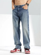 Men’s washed straight jeans in light-wash denim with relaxed straight-leg cut and subtle fading for a casual look