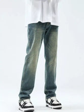 Distressed blue denim men’s washed straight leg jeans with a faded wash and a straight leg cut
