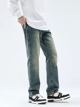 Distressed blue denim men’s washed straight leg jeans with faded wash and straight leg cut