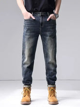 Men’s dark-wash denim washed straight leg jeans with slim fit and rolled cuffs for a modern look