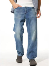 Men’s washed wide leg jeans in light-wash blue denim with a relaxed straight-leg cut wide leg jeans