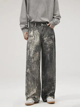 Men’s washed wide-leg jeans in distressed mottled gray and black denim with a relaxed fit and casual style