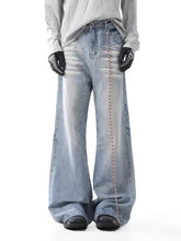 Men’s washed wide leg light-wash denim jeans with subtle red chain detail on outer seam wide leg jeans
