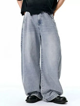 Men’s light-wash denim wide leg jeans with relaxed tapered fit and frayed hem for casual wear