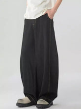 Men’s washed wide leg jeans in black denim with contrasting light stitching and a relaxed fit