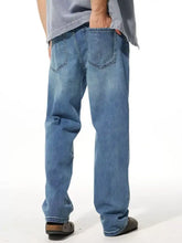Men’s washed wide leg jeans in blue denim with a classic straight-leg cut and visible stitching