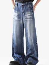 Men’s washed wide leg jeans in blue denim with faded distressed detailing and a relaxed fit wide leg style