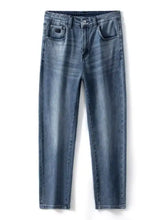 Men’s blue denim wide leg jeans with faded wash and classic five-pocket design in a washed wide leg style