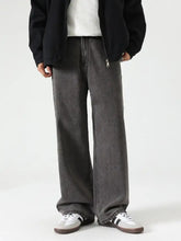 Men’s washed wide leg jeans in dark gray denim with a relaxed straight-cut silhouette for casual wear