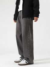 Men’s washed wide leg jeans in dark gray denim with relaxed fit and frayed hem for casual wear